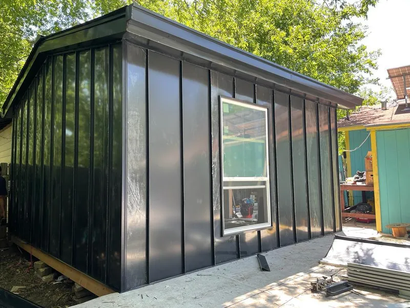 Black standing seam metal wall panels for Roof Inspection in Allendale